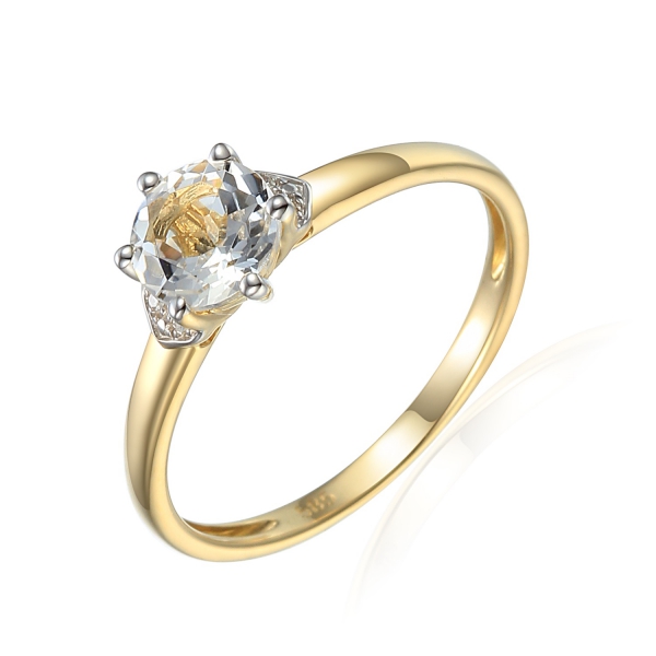 Złoty pierścionek z diamentami i białym topazem